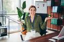 Female employee shrugging in office