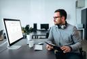 Man using TRAXsuite on desktop computer