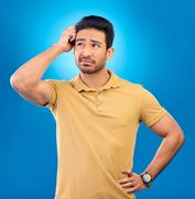 Confused man with blue background
