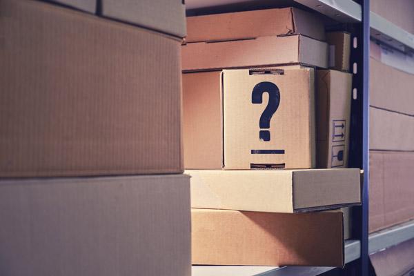 Pile of boxes with a question mark