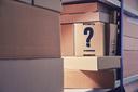 Pile of boxes with a question mark