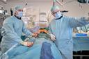 Martin Austermann, MD and Michel Bosiers, MD work closely together during the procedure