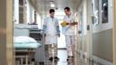 Dr. Mario Jreige and Martin Pappon walk the halls of CHUV.