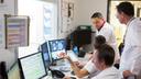 Colleagues at the CHU Nîmes reading and discussing CT scans.