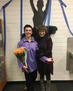 Anne and Zane with flowers in his hand behind the scenes of one of his shows.