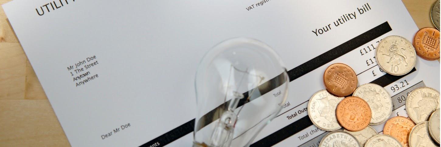 a utility bill on a table showing the amount paid for gas and electricity