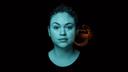 Siemens Healthineers allergy testing key visual depicting a woman's face in teal tones with an artistic orange overlay on the right side
