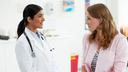 Female doctor with female patient