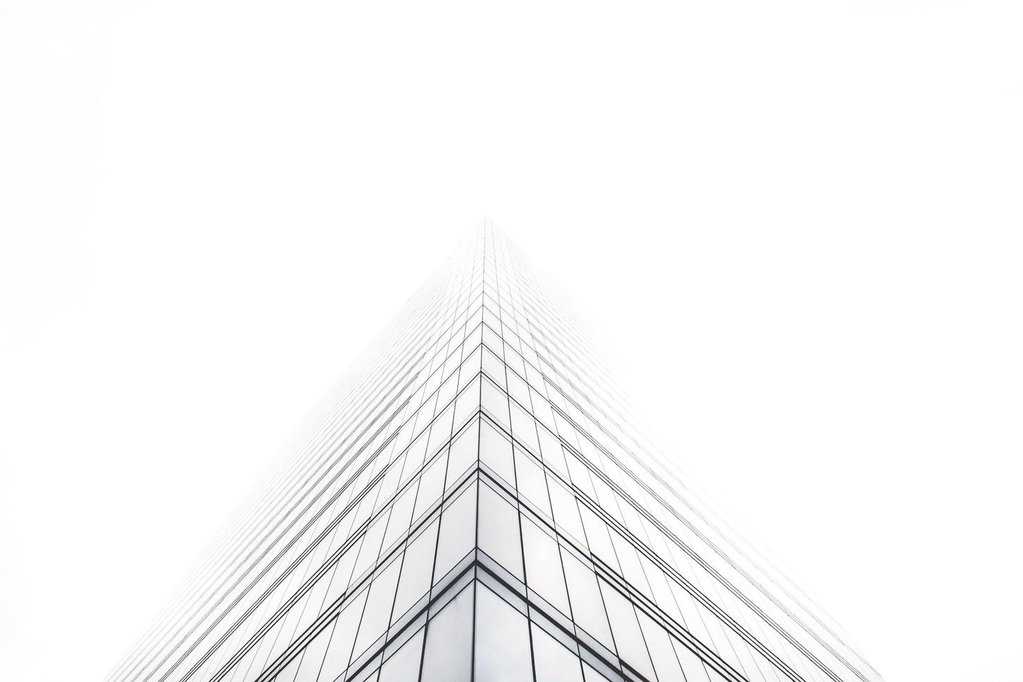 Building corner with clouds
