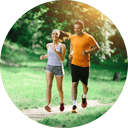 A man and a women running in a park