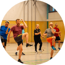 Men doing sports together in a gymnasium