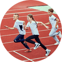 Students running on a track during physical education class
