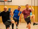 Men doing sports together in a gymnasium