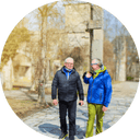 Two men taking a walk outside together while talking