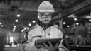 Man in a factory working with iPad