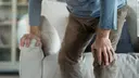 Old man suffering from knee pain 