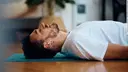 Man lies relaxed on his back.