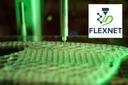 Mithilfe von Fluid-MEX gefertigtes Silikonbauteil; eingefügt ist das FLEXNET-Logo