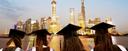 Four students with graduation cap look at a city in China