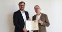Prof. Dr. Christoph Kurat und Universitätspräsident Prof. Dr. Stefan Leible