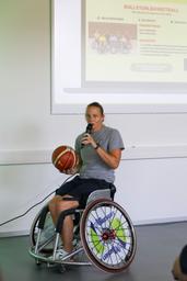 a woman with a basket ball