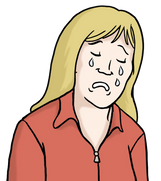 Die Abbildung zeigt eine Frau, die weint. Sie hat blondes Haar, trägt eine rote Bluse und schaut sehr traurig.